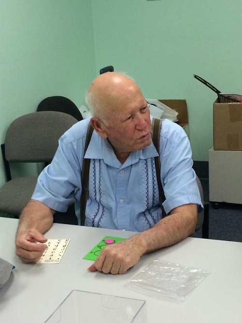 Ramiro playing Loteria using Braille